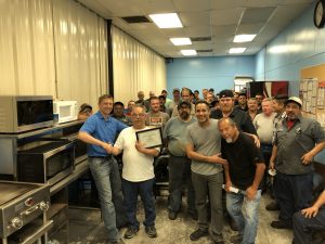 Employees celebrating Ricardo Santillan's 40 anniversary at Anthony Machine precision machine shop